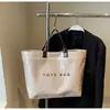 Bolso Tejido de Gran Capacidad para Llevar en la Mano para Mujer 2025 Verano Nueva Moda Casual Bolso de Paja para el Trabajo y Ropa de Trabajo Bolso Grande de un Solo Hombro