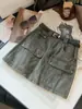 Falda vaquera de cintura alta estilo workwear retro para mujer, nueva colección otoño 2026, versátil, estiliza la figura y cuenta con múltiples bolsillos, falda corta de línea A