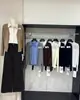 Conjunto de duas peças estilo preppy coreano para outono e inverno: cardigã de tricô com camisa de gola patchwork, novo modelo justo, top que rejuvenesce