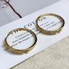 D hogar Europa y Estados Unidos retro simple moda aretes chapado en cobre oro de 18 quilates incrustado circonita arete de círculo grande joyería al por mayor