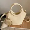 Bolsa de Moda Elegante para Mujer Verano 2026 Transfronteriza, Bolso de Hombro Cruzado Individual, Bolso Cubo de Mano Texturizado de Moda