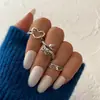 Anillo de mariposa negro esmaltado con forma de corazón oscuro para Halloween, juego de nueve anillos estilo punk de araña