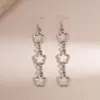 Pendientes Metálicos Huecos con Diseño de Flor Transfronterizos Europeos y Americanos, Pendientes de Lujo Ligero de Gama Alta, Accesorios para Orejas de Nicho Elegantes y Sencillos al por Mayor