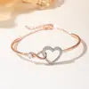 Amazon Más Vendido Pulsera Abierta de Brazalete Corazón de Circonita Hueca Estilo Versátil de Lujo Ligero Emoción de Gama Alta Pulsera de Pareja para Mujeres