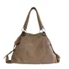Bolso de mano transfronterizo estilo retro con tachuelas para mujer, nuevo bolso tote de moda 2026, bolso de mano simple de gran capacidad