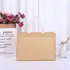 El fabricante suministra bolsas no tejidas hechas a medida, cosidas y laminadas, bolsas de embalaje para regalo al por mayor y bolsas promocionales