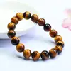 Pulsera de Piedra Ojo de Tigre Amarillo Natural Grado 5A Guan Yu Pulsera de Perlas Redondas de Ojo de Tigre Venta al por Mayor en Transmisión en Vivo S5040601