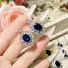 Joyería Camellia Transfronteriza Nuevo Tesoro Azul Natural Imitación Colgante Traje Lujo Completo Diamante Diseño Industria Pesada Anillo Tesoro Color