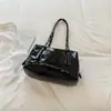 Bolsa vintage de gran capacidad, nuevo modelo principios de otoño 2026, bolso de hombro o axila casual texturizado, bolsa tote de alta apariencia para el día a día