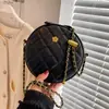Bolso pequeño texturizado para mujer verano 2022 nueva moda este año popular nicho cadena de rombos bandolera pequeño bolso redondo al por mayor