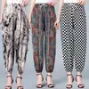 Nuevo Estilo Verano Pantalones de Seda de Hielo con Puño Elástico y Flores Pantalones Acampanados Elásticos para Mamá Pantalones de Verano Florales para Mujeres de Mediana Edad