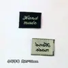 Logotipo de fábrica se puede pedir accesorios para el cabello material marca registrada hecha a mano parche marca tejida etiqueta de tela etiqueta impresa en inglés accesorios de joyería al por mayor