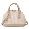Bolsa popular de concha de paja para mujer de este año, nuevo modelo de verano 2026, bolso de hombro color block con textura de alta calidad, bolso cruzado