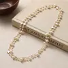 Elegante collar largo de perlas estilo coreano para mujer, versátil para otoño e invierno, exquisita cadena para suéter, colgante de letra simple y único, venta al por mayor