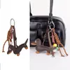 Venta al por mayor de fábrica Ins Retro Perro Salchicha Colgante para Bolso Serie Miu Cachorro Cuerda Trenzada Hecha a Mano Llavero de Pareja Cordón
