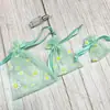 Nova Bolsa de Presente com Cordão de Organza de Margarida Bolsa de Armazenamento de Joias Cosméticas E-commerce Transfronteiriço Bolsa Fresca com Cordão