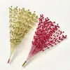 Decoración navideña bola dorada racimos de pistacho racimos de bayas doradas esquejes dorados tenedorcito flor artificial hilo de pez fruta