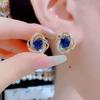 Elegantes pendientes de flor azul de circón en espiral, diseño súper brillante, pendientes exquisitos, pendientes de lujo ligero, estilo Hong Kong