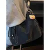Bolsa Feminina Nova Estilo Coreano Vintage Moda Primavera 2026 Bolsa de Ombro para o Trabalho Bolsa de Mão de Nicho Bolsa Tote Vintage