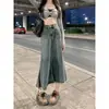 Saia Jeans Estilo Hong Kong Retrô Feminina 2026 Nova Desfiada de Comprimento Médio Cintura Alta Emagrecedora Linha A Justa no Quadril Saia Jeans