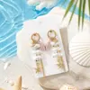 Novos brincos de estilo de férias no oceano mais vendidos, brincos pendentes de estrela-do-mar, concha e coral, design decorativo ins, brincos de luxo leve para mulheres