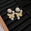 Pendientes de plata con forma de mariposa y flor de perla retro francesa, pequeños y exquisitos, de alta gama, con diseño de hada súper dulce para mujer.