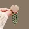 Novo broche estilo antigo de alta qualidade ins para mulheres estilo chinês leque borla pino de terno placket de pressão cheongsam corsage atacado