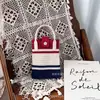 Bolso pequeño portátil de verano 2024, nuevo y popular bolso cruzado de punto para teléfono móvil.