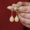 Pendientes de jade Hetian natural de loto temprano para mujer pendientes de jade Plata de ley Chapado en oro Diseño retro de pendientes largos sentido del diseño
