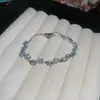Pulsera de Zircón Aguamarina Ovalada con Lazo Exquisita de Lujo Ligero Pulsera de Sentido de Alta Gama Pulsera de Sentido de Diseño de Nicho