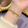 Tienda de oro con pulsera de mariposa azul quemada en arena dorada pulsera de ojo de gato bola de seda exquisita joyería de diseño de nicho para mujer