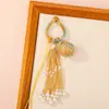 Nuevo Bolso Colgante de Bola de la Suerte Tejido a Mano Bolso Colgante Encanto Tendencia Nacional Nicho Borla Llavero de Pareja Colgante Venta al por Mayor