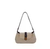 Bolso de axila retro de gamuza nuevo 2026 para mujer, bolso de hombro cruzado de alta gama con colgante de bola de pelo, bolso tote para el día a día