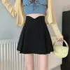 Elegante falda corta de cintura alta para mujer talla grande, nuevo estilo coreano de otoño e invierno, versátil falda corta de línea A irregular que cubre la cadera