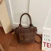 Bolso de mano de mujer de alta gama, nicho, estilo vintage, de importación, nuevo bolso de hombro de moda 2026, bandolera tipo cubo versátil