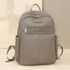 Mochila Simples Feminina 2025 Primavera Nova Lazer Mochila Feminina Moda Transfronteiriça Cor Sólida Pano Oxford Mochila Feminina