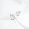 Pendientes Xuping de estilo ruso con forma de lágrima, transfronterizos europeos y americanos, hechos de aleación de cobre con baño blanco, que exudan un encanto de lujo ligero y elegante, con un diseño de doble anillo