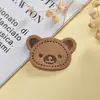 Roupas coloridas urso redondo sinal de couro etiqueta de couro em relevo roupas sapatos e chapéus acessórios fabricantes atacado pronta entrega