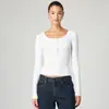 Camiseta de punto acanalado de cuello redondo con botones en el hombro recto, moda 2025 para mujer, color liso, top versátil de manga larga para ir al trabajo