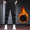 Calças Masculinas Outono e Inverno Calças de Moletom Casuais Masculinas com Forro de Fleece Calças de Veludo Grossas Modelo Harem Relaxado