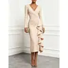 Enviado 2026 Sitio independiente transfronterizo europeo y americano wish Vestido simple de color liso con cuello en V y manga larga con volantes