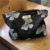 Nicho elegante jacquard nylon bolsa de cosméticos artístico retro elegante flor conveniente clutch bolsa a cuadros transfronteriza