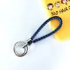 Chaveiro de corda trançada com anel duplo chaveiro de couro PU colorido novo pingente para bolsa feminina chaveiro para pendurar na cintura