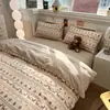 Juego de cuatro piezas de jacquard de algodón lavado, modelo nuevo, juego de Clase A amigable con la piel para dormir sin ropa, disponible en múltiples tamaños, listo para distribución y se puede enviar en nombre de los clientes