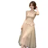 Nuevo estilo de top de tirantes de encaje inspirado en Chanel + falda larga de malla, conjunto de alta gama y único para mujeres en verano