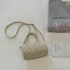 Bolsa de ombro e axila fofa estilo coreano para garota popular do milênio 2026 nova bolsa transversal de nicho bolsa de mão leve com bolinhas