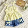 Conjunto de verão feminino INS transfronteiriço: novo top de alça floral estilo férias + calça jeans retrô, confortável e casual, atacado