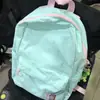 Mochila simple y fresca de color liso 2023 nueva mochila ligera para estudiantes bolso de mano casual de moda versátil para mujer