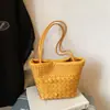 Bolso de mano tejido nuevo para la primavera de 2026 para mujer, estilo coreano, bolso de hombro de nicho de alta gama, bolso cesta versátil para el día a día