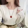 Camisa base amarilla para mujer, nuevo suéter de punto de cuello redondo para otoño e invierno 2026, top extremadamente elegante para otoño e invierno